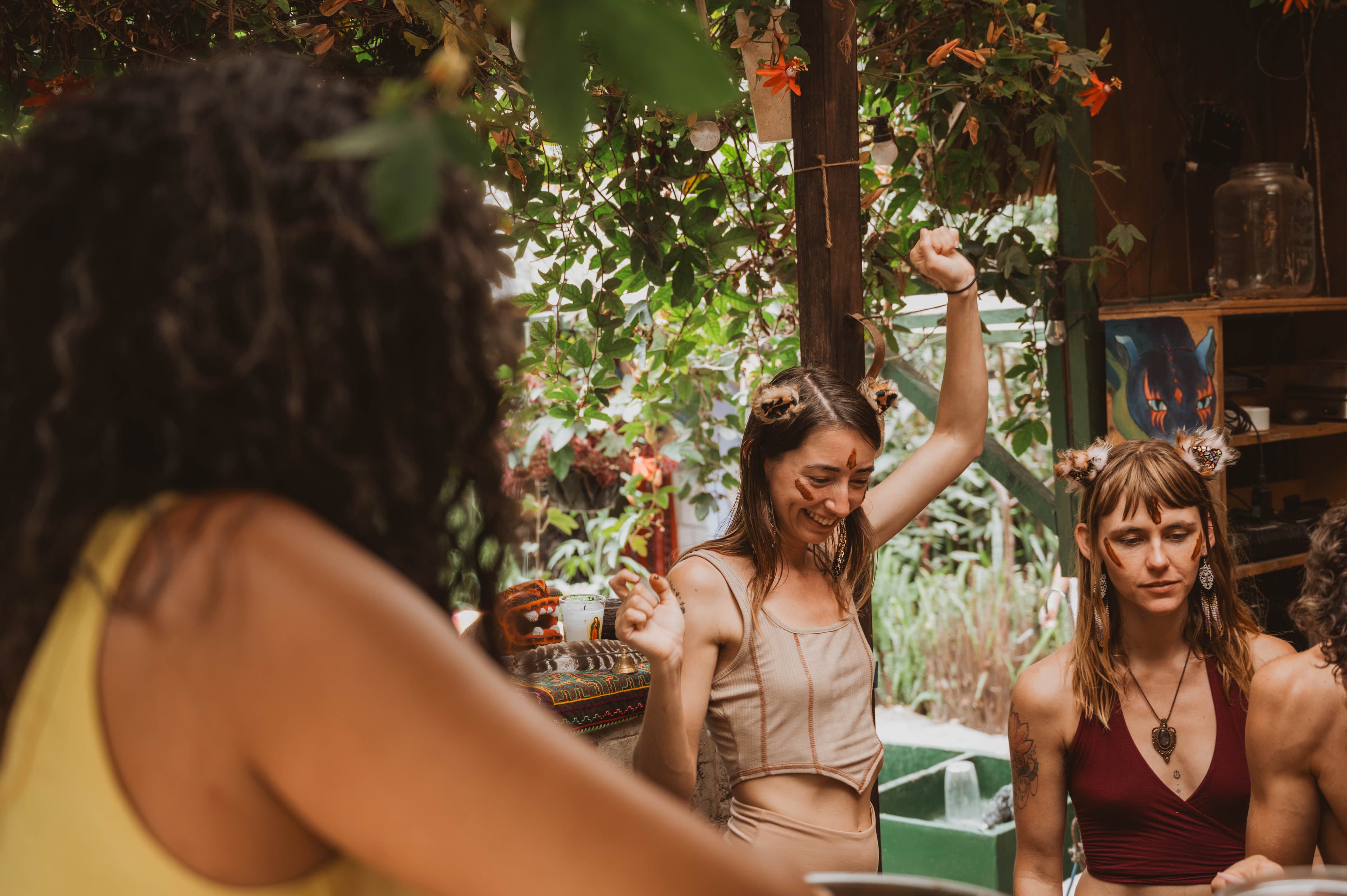 Cacao Source training community dancing under the trees at Mystical Yoga Farm