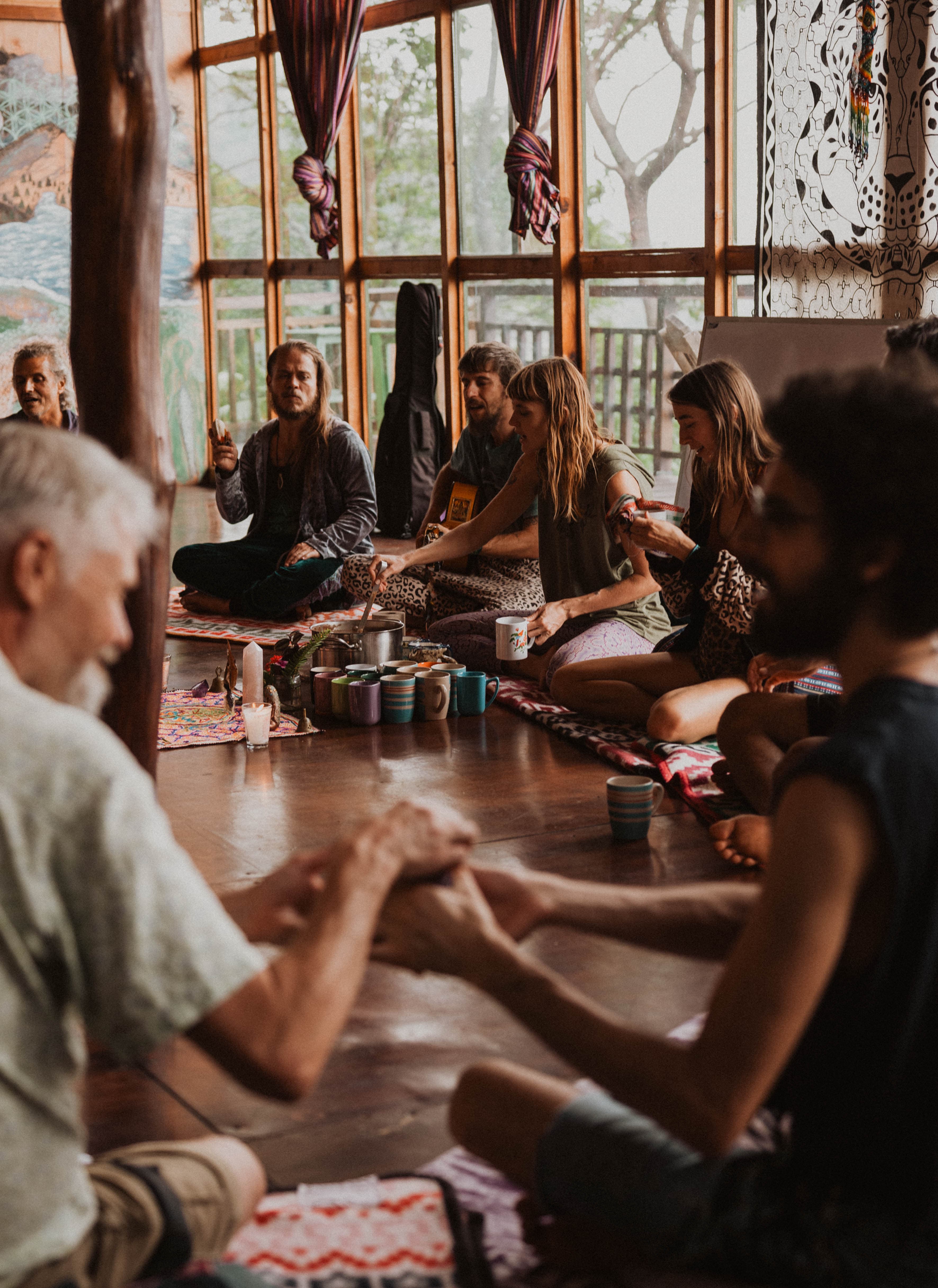 Cacao poured into mugs in circle at Mystical Yoga Farm