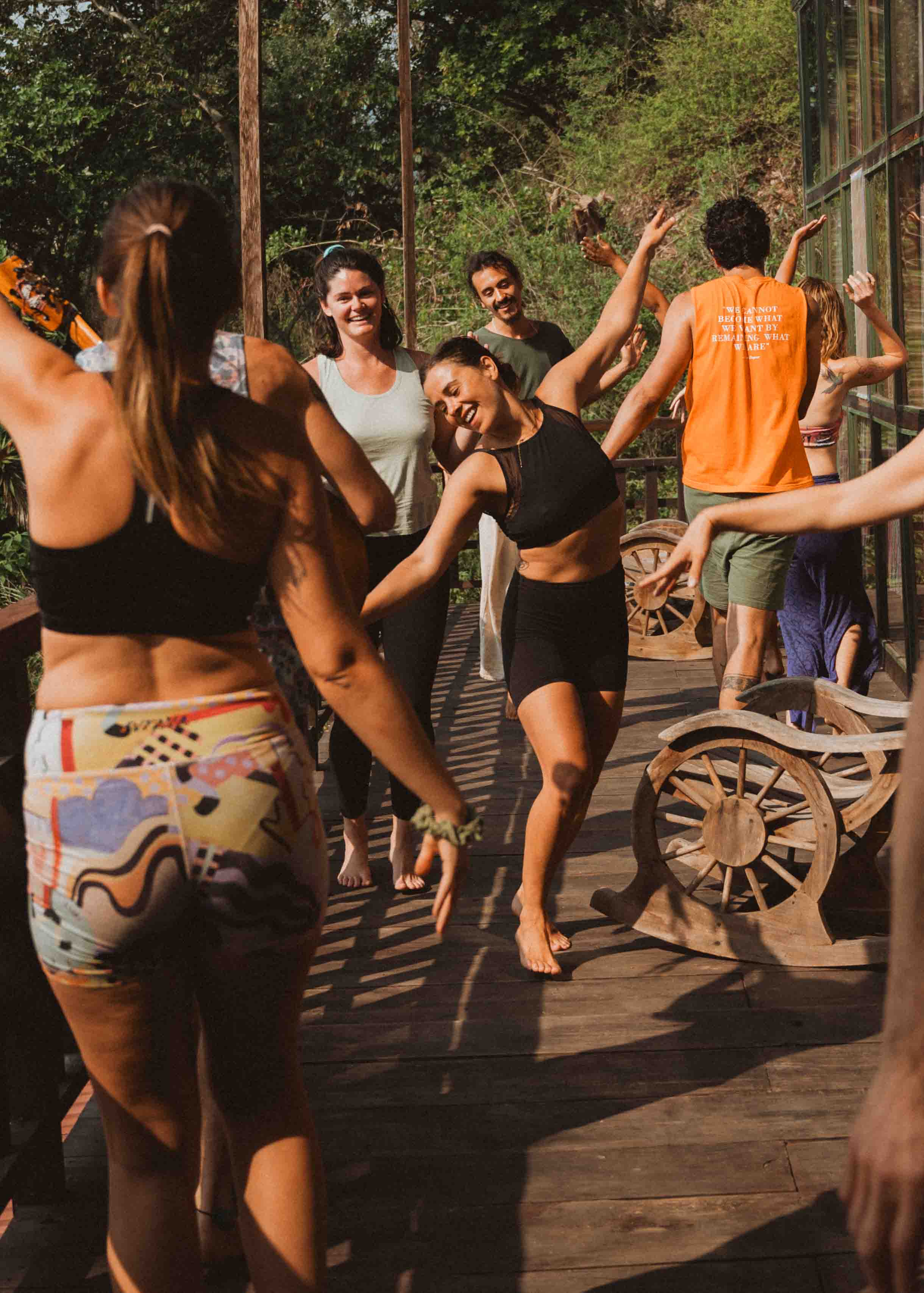 Community dancing on the wooden deck at Mystical Yoga Farm