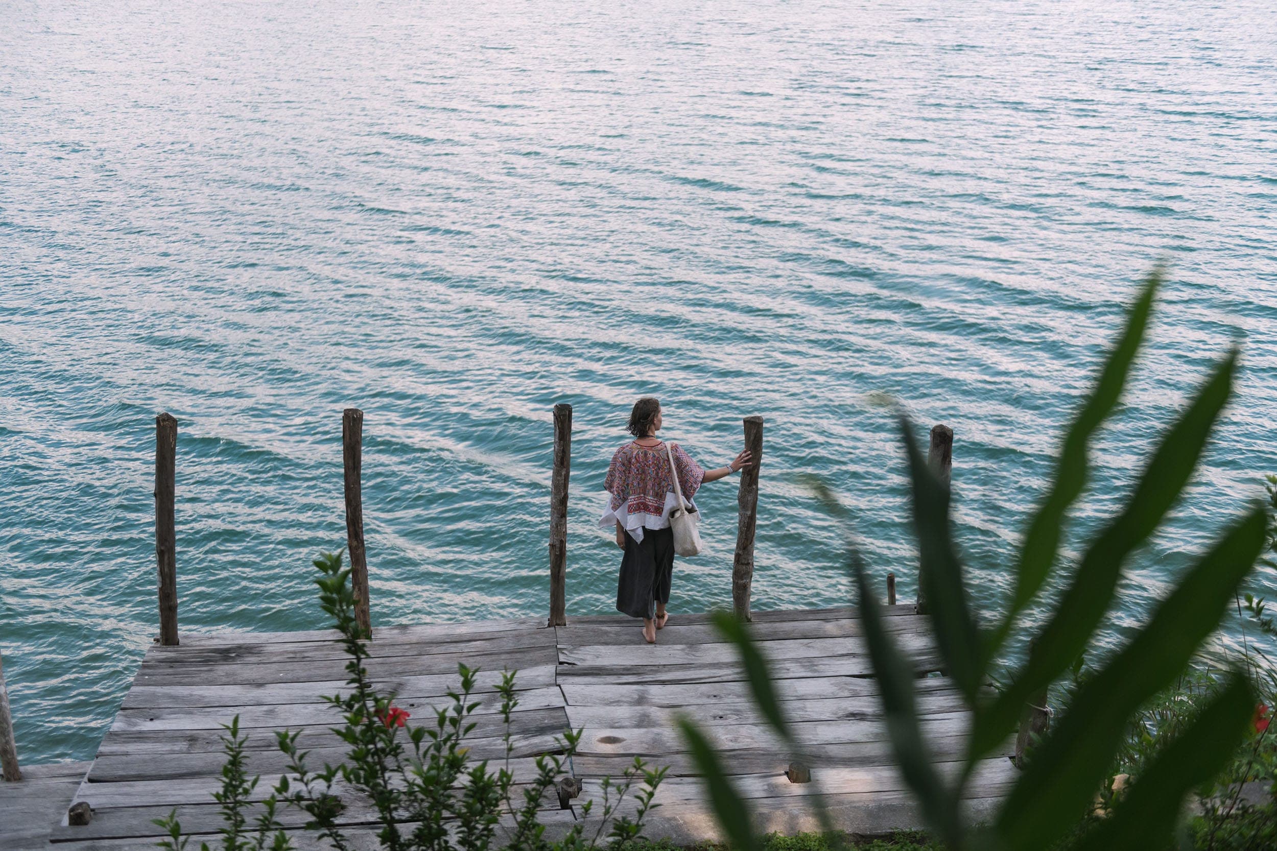 Guest on the dock looking out over Lake Atitlán