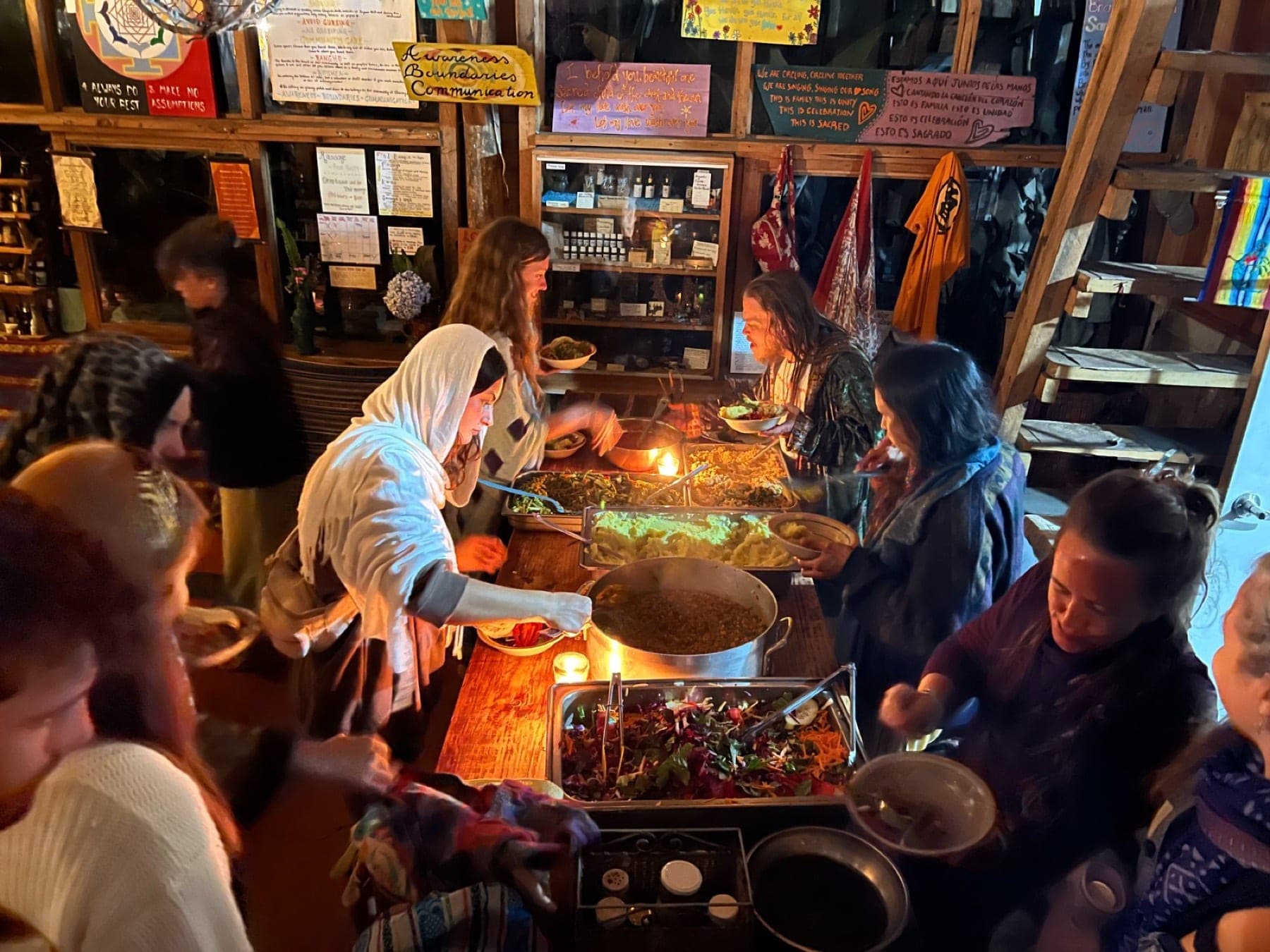 Guests serving vegan lunch in the farm kitchen