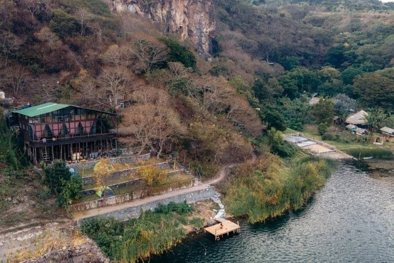 Open-air hall at Mystical Yoga Farm surrounded by forest